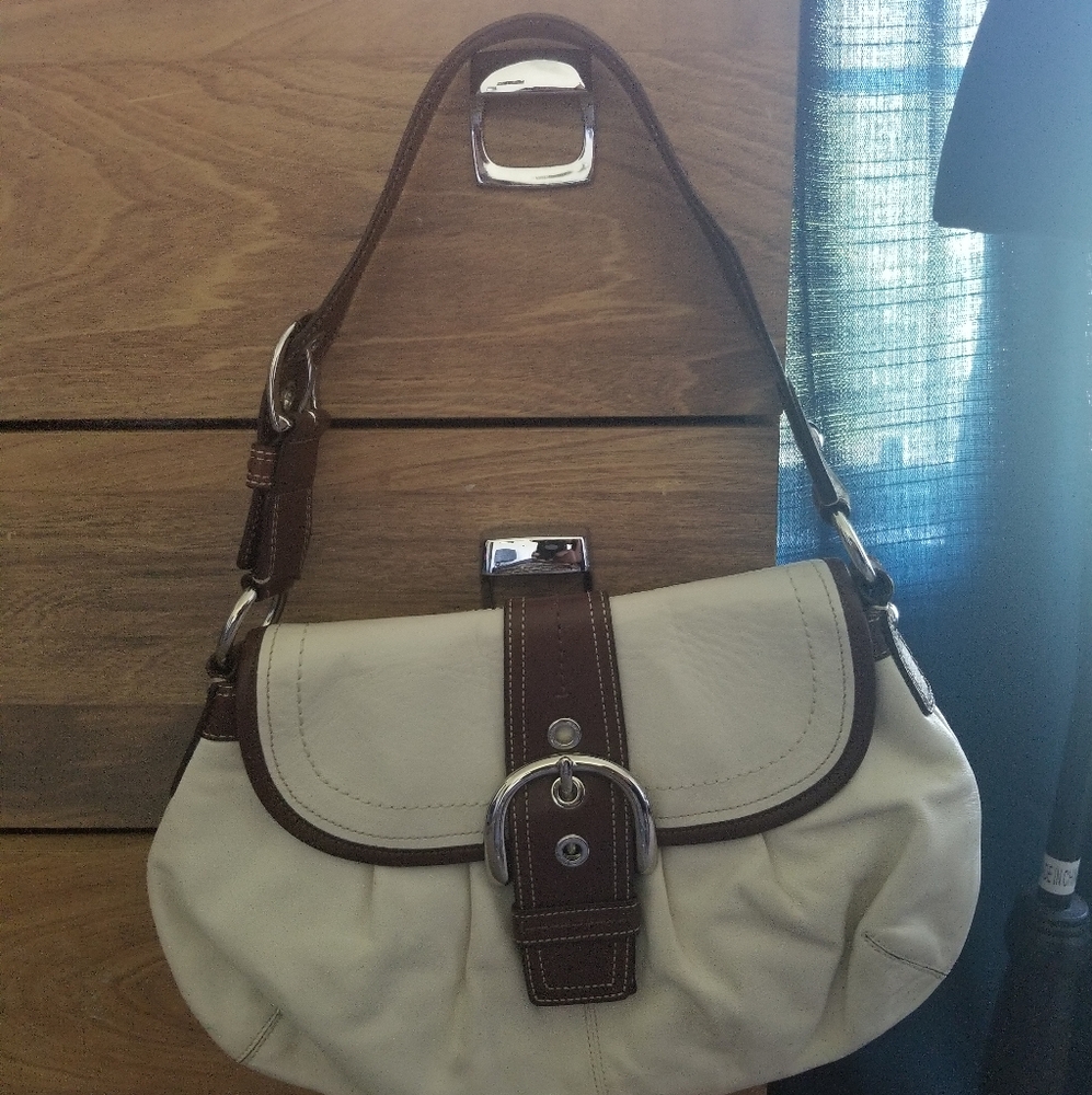 White and brown Coach purse